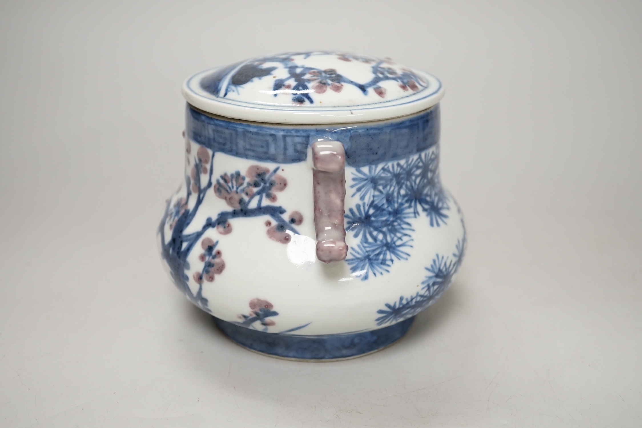 A Chinese underglaze blue and copper red pot and cover, 12cm high